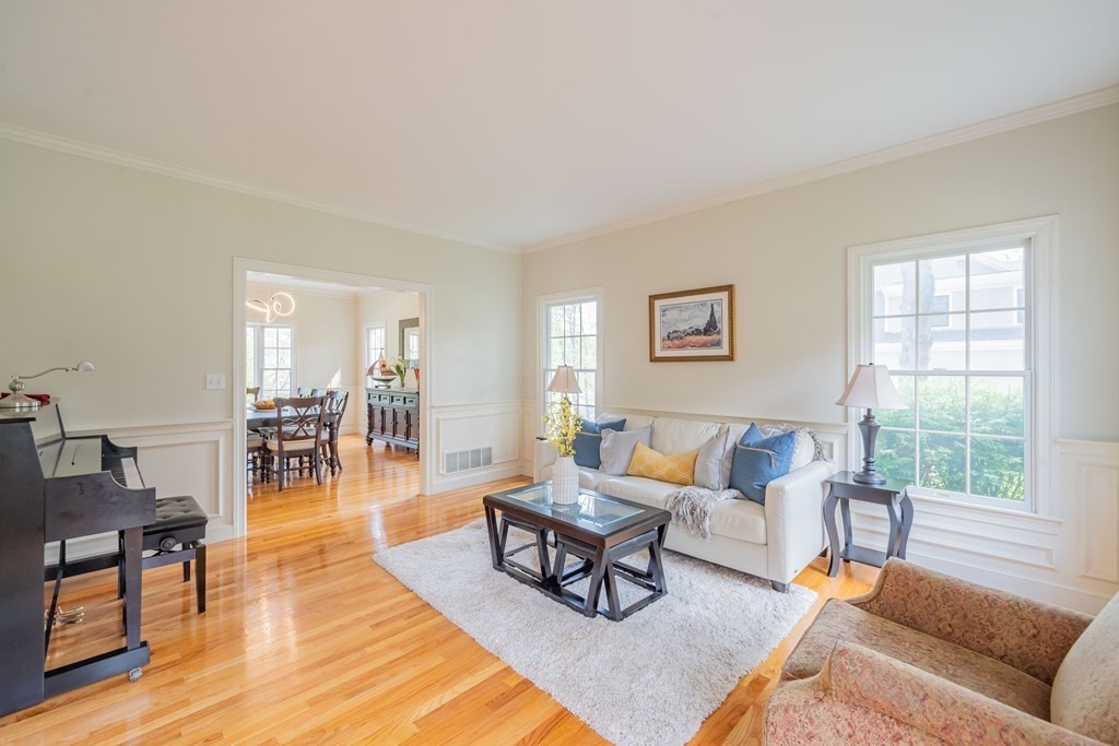 9 Bates Road Lexington, MA 02421 - Photo 3 of 42 a living room with furniture and a wooden floor