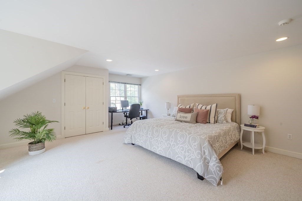 9 Bates Road Lexington, MA 02421 - Photo 32 of 42 a bedroom with a bed and a couch
