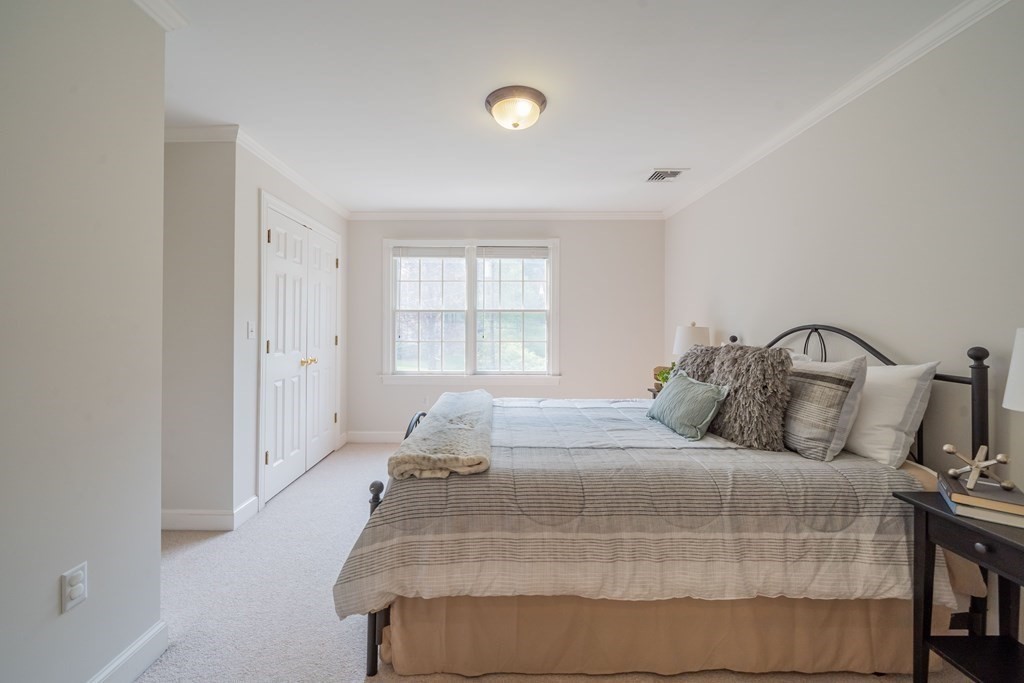 9 Bates Road Lexington, MA 02421 - Photo 34 of 42 a bedroom with a bed and window