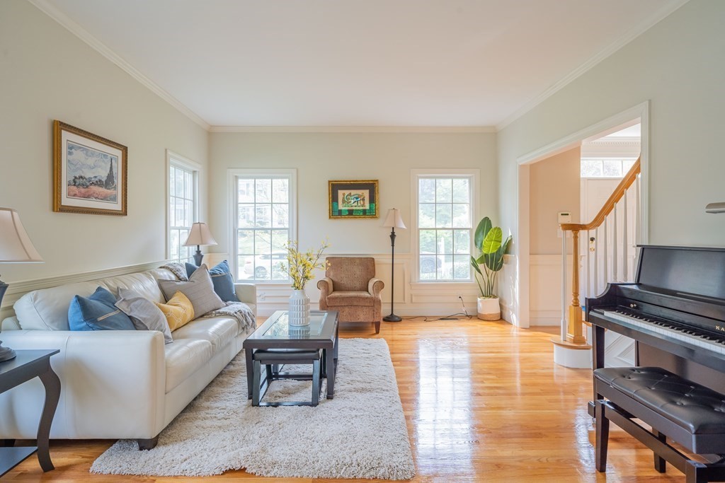9 Bates Road Lexington, MA 02421 - Photo 5 of 42 a living room with furniture and a wooden floor