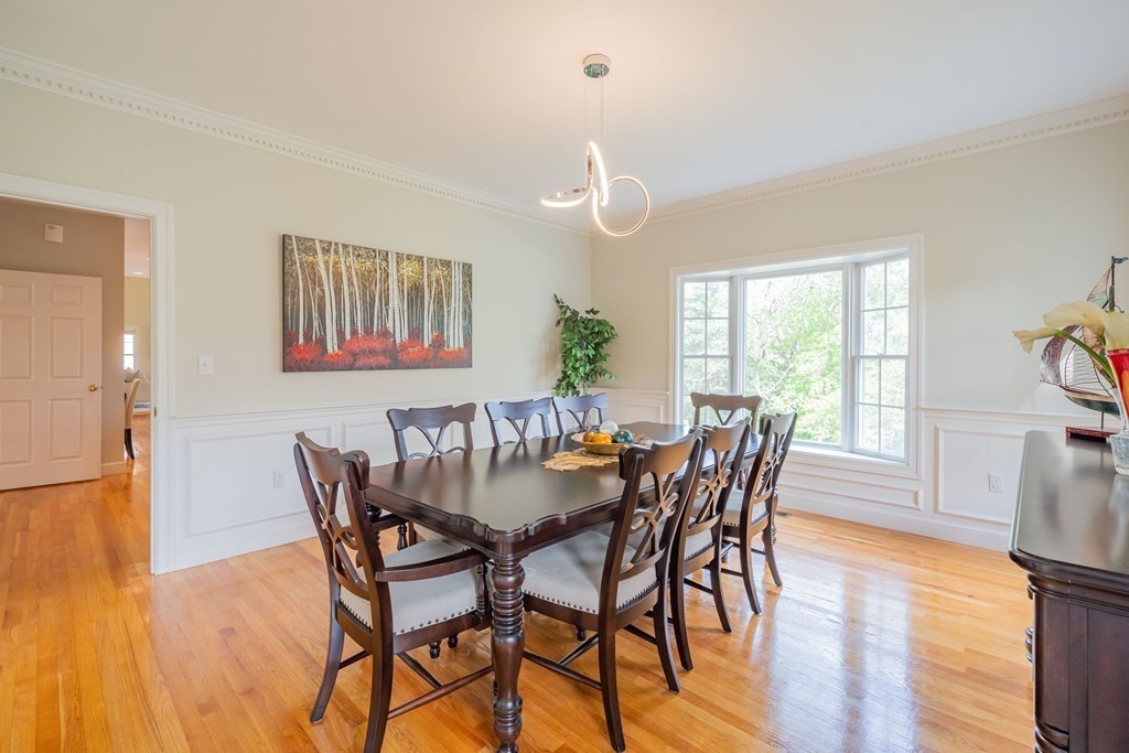 9 Bates Road Lexington, MA 02421 - Photo 7 of 42 a view of a dining room with furniture window and wooden floor