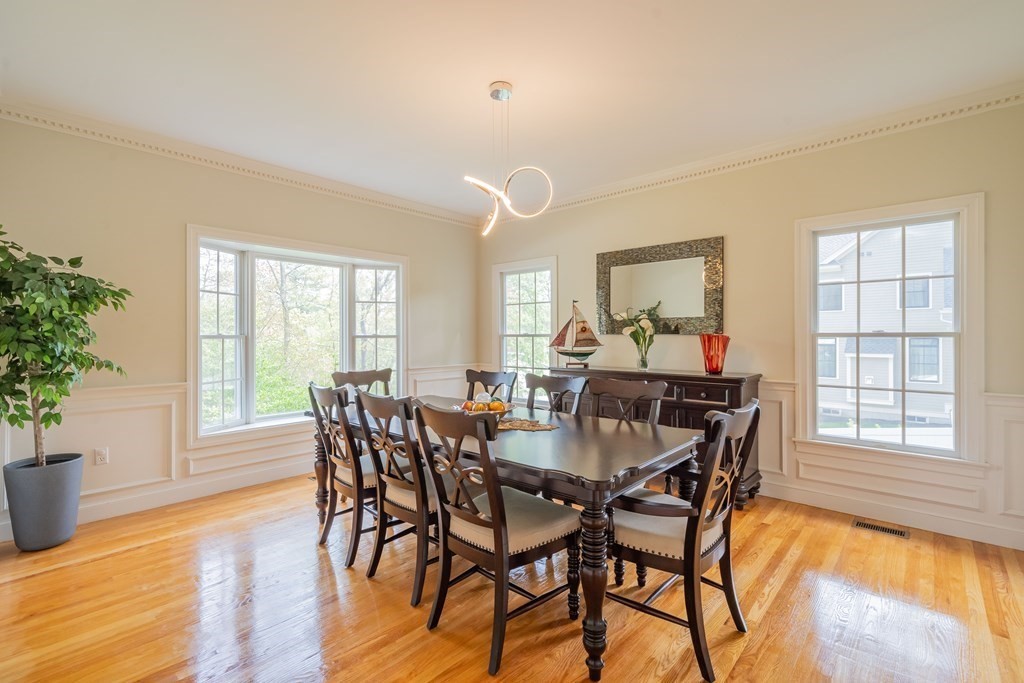 9 Bates Road Lexington, MA 02421 - Photo 8 of 42 a view of a dining room with furniture window and wooden floor