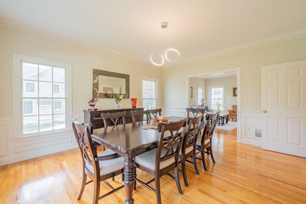 9 Bates Road Lexington, MA 02421 - Photo 9 of 42 a view of a dining room with furniture and wooden floor