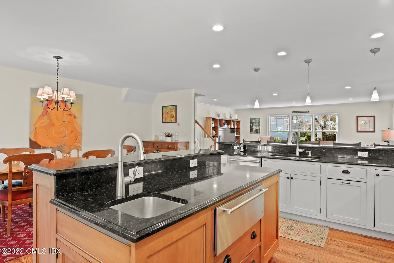 4 Rainbow Drive Riverside, CT 06878 - Photo 15 of 59 a kitchen with granite countertop a sink stainless steel appliances and white cabinets