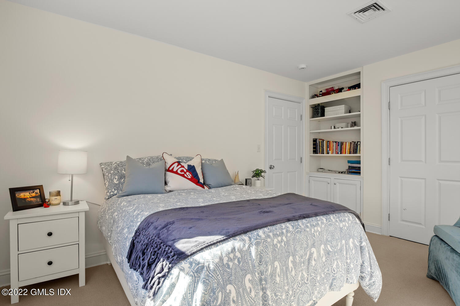 4 Rainbow Drive Riverside, CT 06878 - Photo 23 of 59 a bedroom with a bed and a window