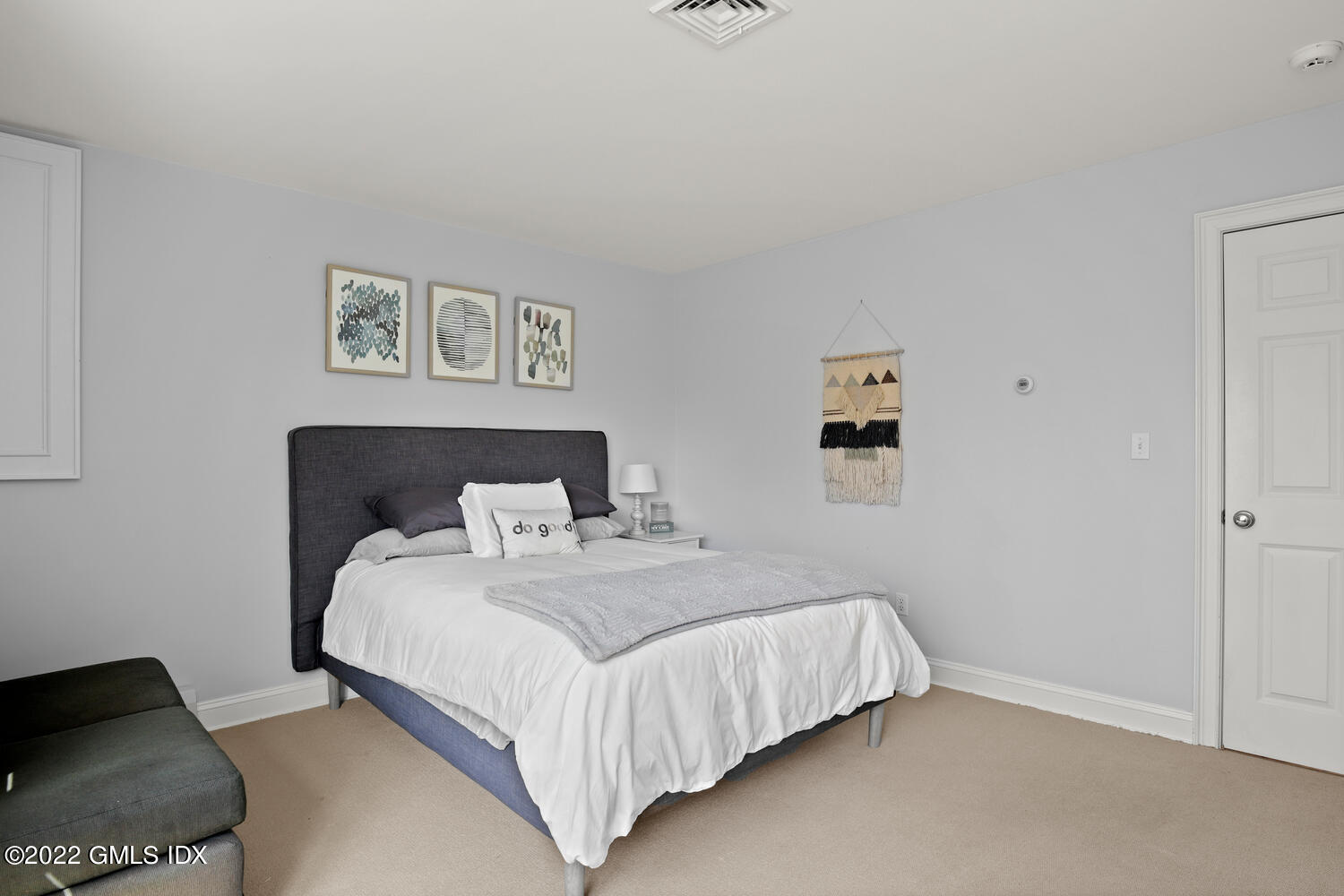 4 Rainbow Drive Riverside, CT 06878 - Photo 27 of 59 a bedroom with a bed and a lamp with window