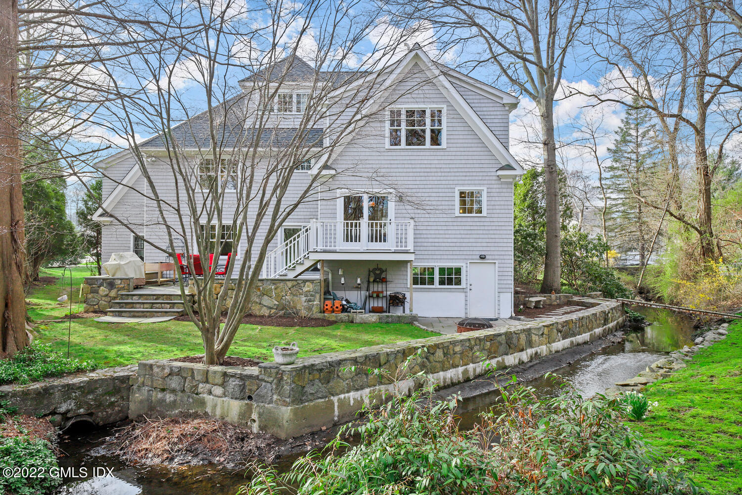 4 Rainbow Drive Riverside, CT 06878 - Photo 46 of 59 a front view of a house with garden