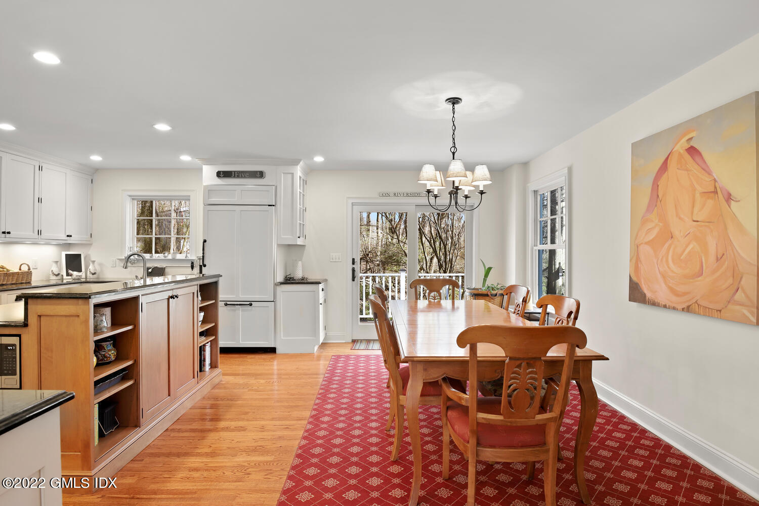 4 Rainbow Drive Riverside, CT 06878 - Photo 10 of 59 a large white kitchen with granite countertop a stove a sink a dining table and chairs