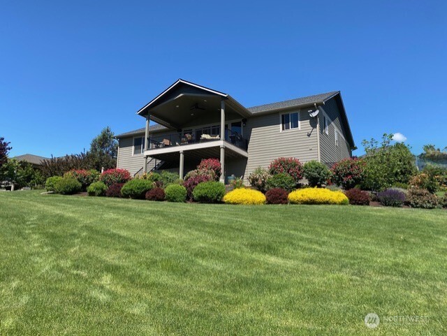 4062 Knowles Road Wenatchee, WA 98801 - Photo 1 of 20 a view of a house with backyard and garden