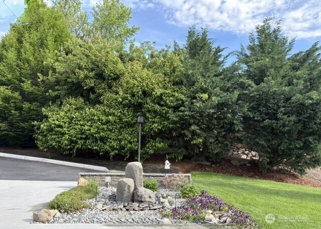 4062 Knowles Road Wenatchee, WA 98801 - Photo 3 of 20 a view of a garden with plants