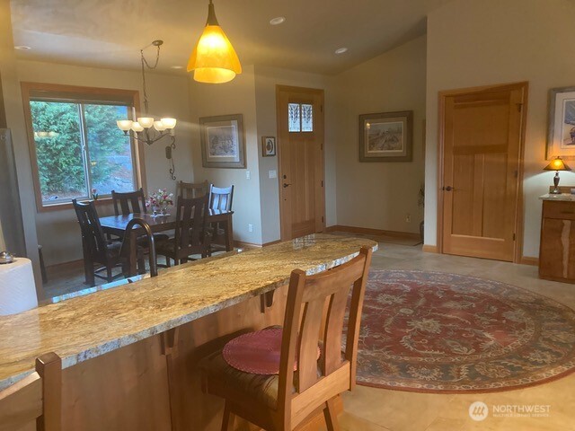 4062 Knowles Road Wenatchee, WA 98801 - Photo 5 of 20 a dining table chairs next to a window with living room