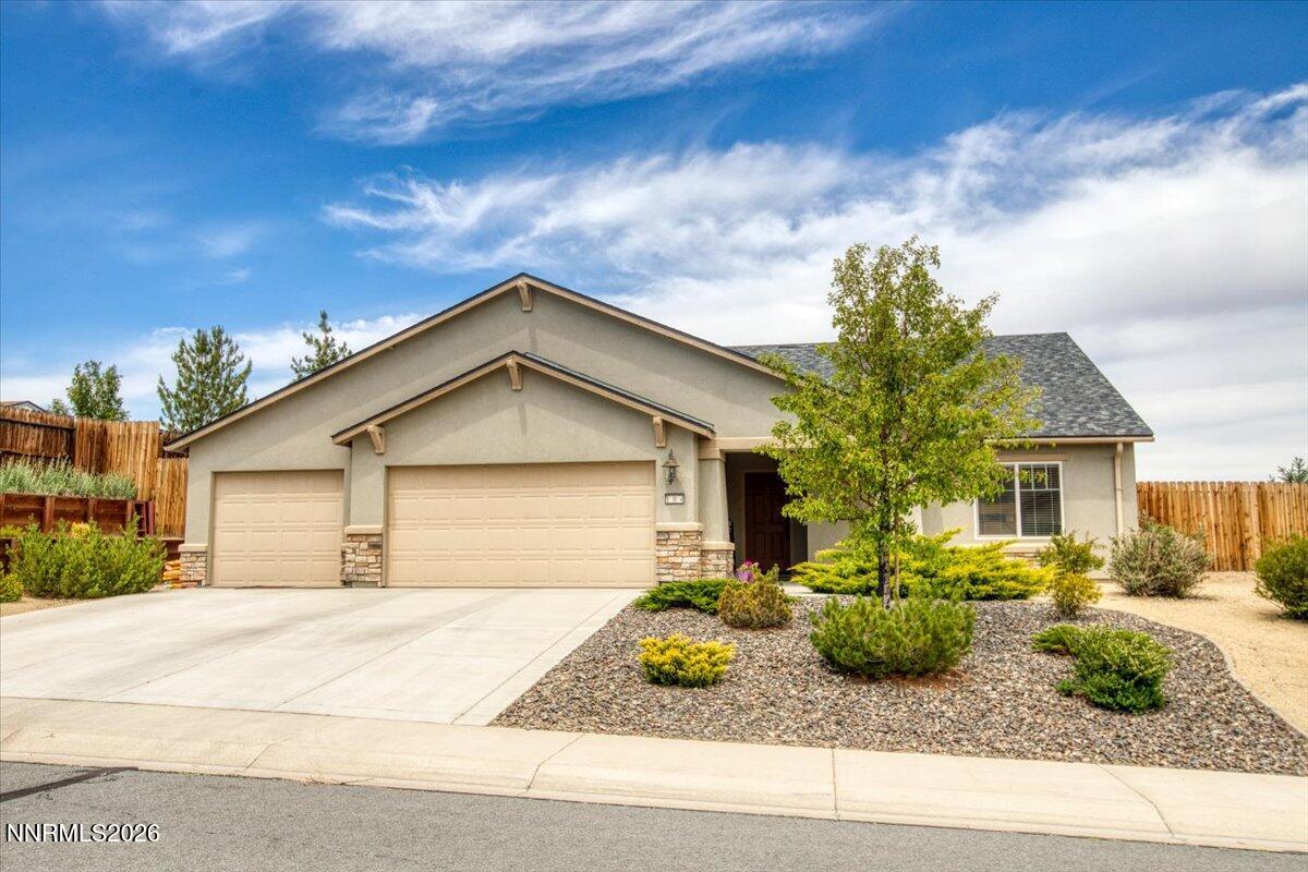 104 Bethpage Road Dayton, NV 89403 - Photo 1 of 65 a front view of a house with garden