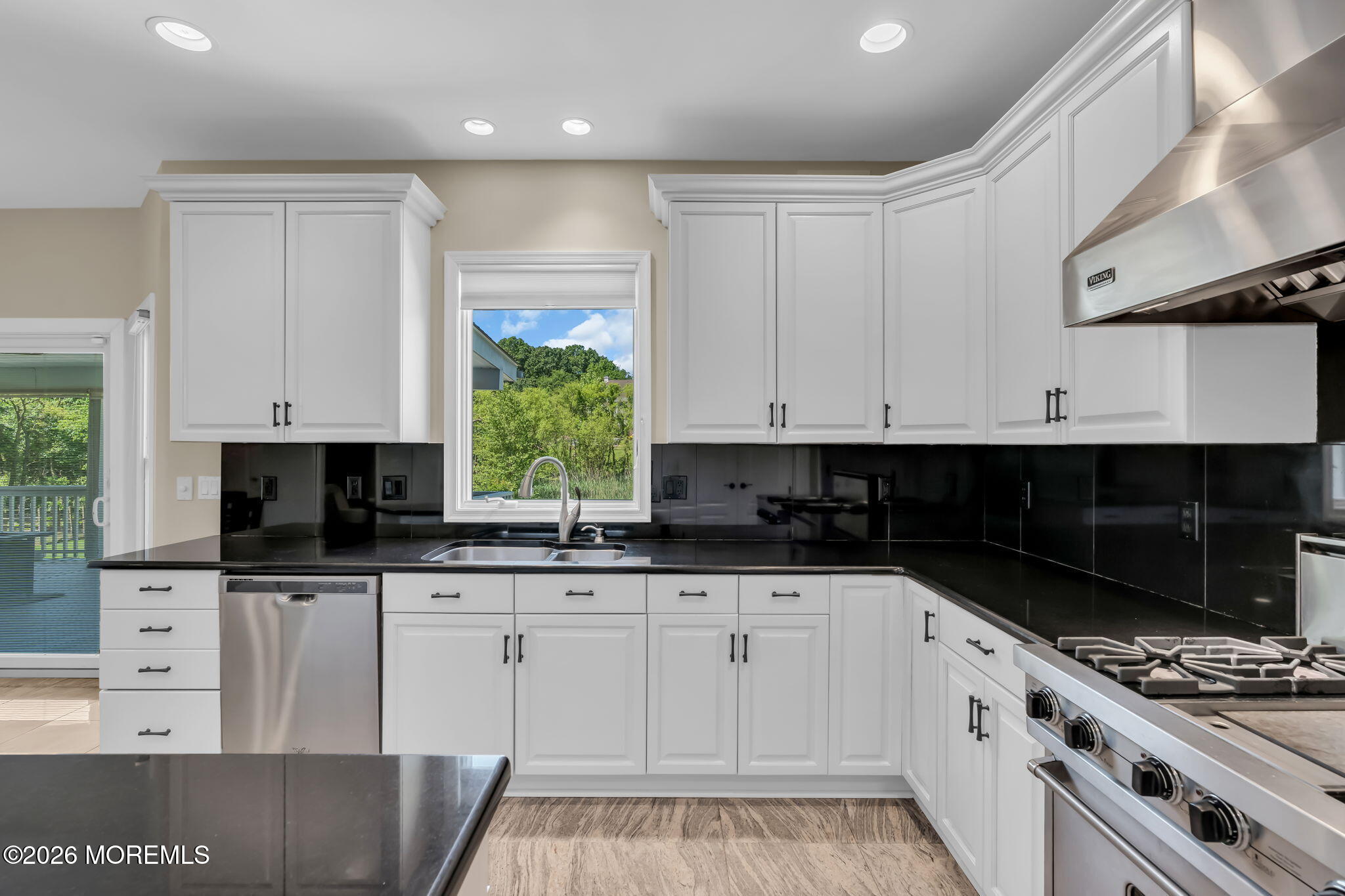 14 Diamond Hill Road Marlboro, NJ 07746 - Photo 22 of 79 a kitchen with granite countertop a sink a stove and cabinets