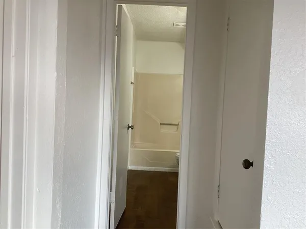 a bathroom with a glass shower door