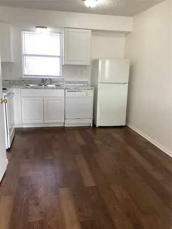a view of a kitchen with a sink