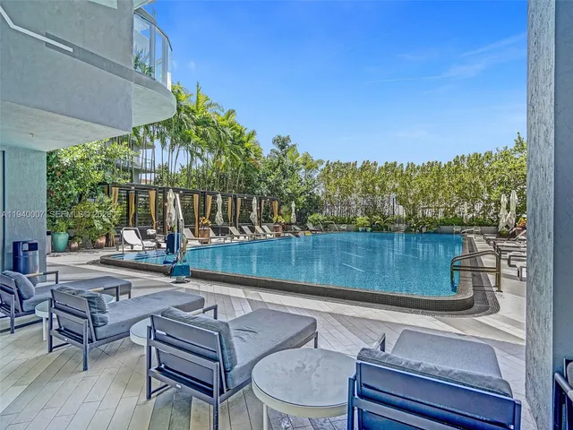 a view of a swimming pool with chairs