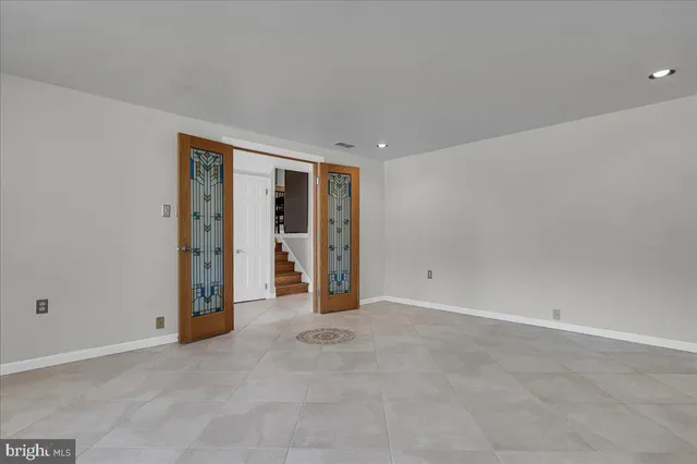 an empty room with closet and bathroom