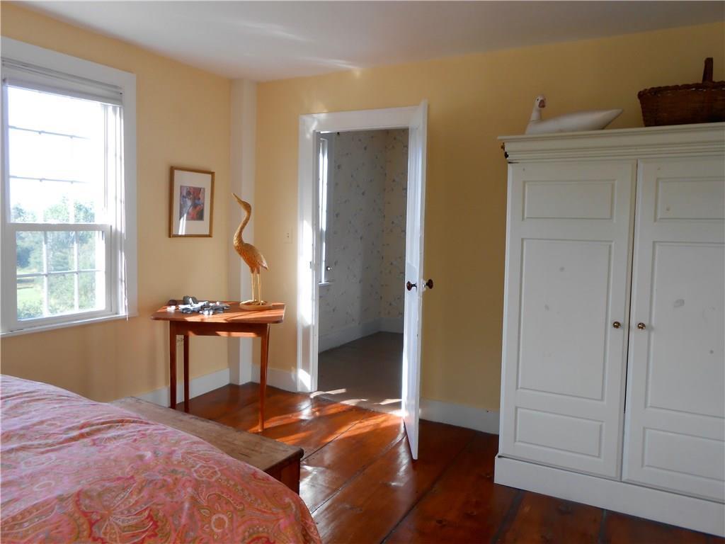 3 River House Road Castine, ME 04421 - Photo 13 of 26 Light floods into bedroom with wide...