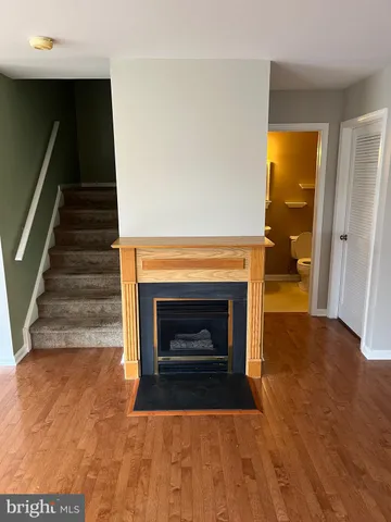 a kitchen with granite countertop a sink cabinets and stainless steel appliances