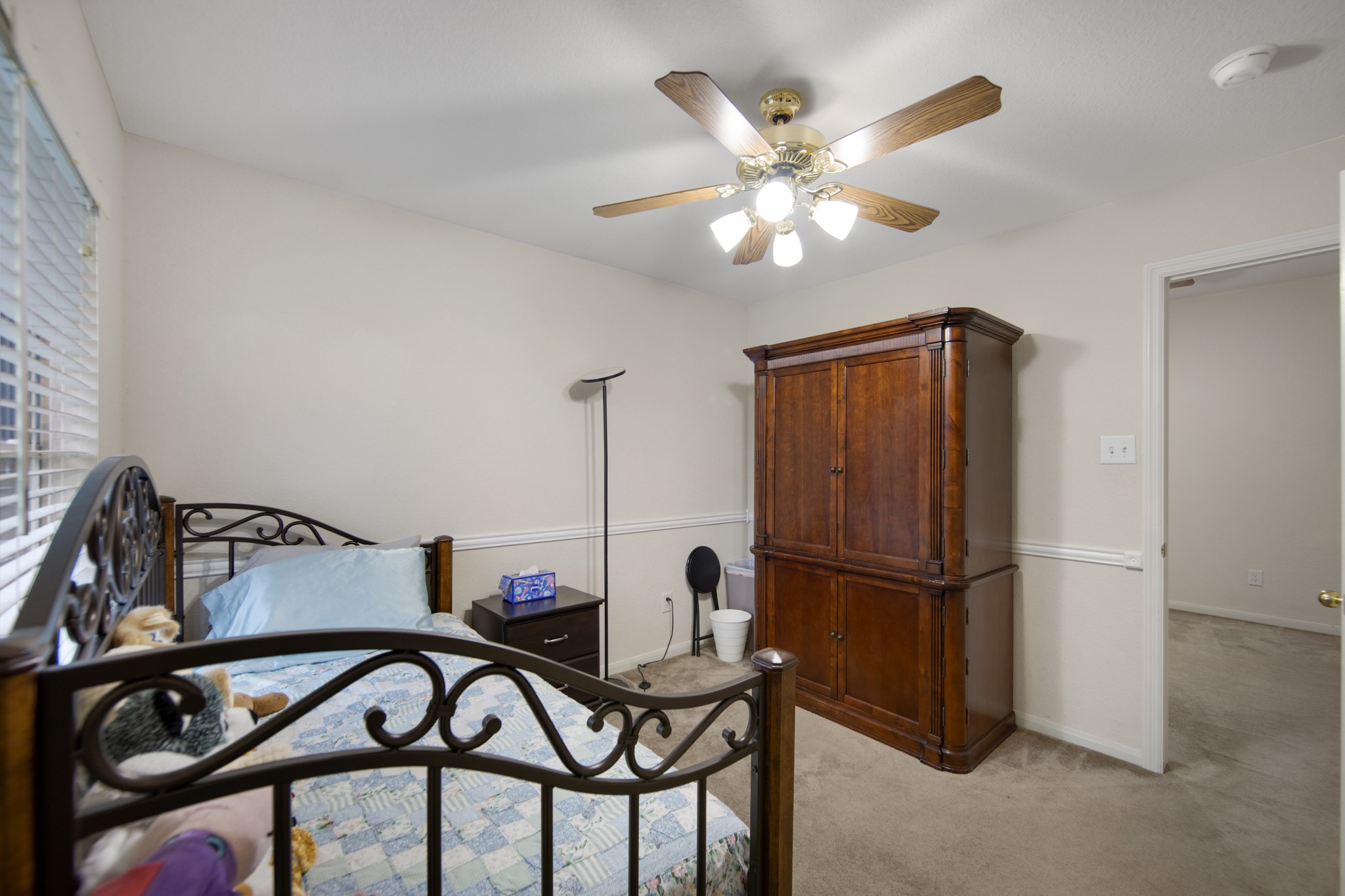 19414 Camellia Bend Circle Spring, TX 77379 - Photo 31 of 49 All the bedrooms have ceiling fans and this one has chair railing added, additionally it has a walk-in closet