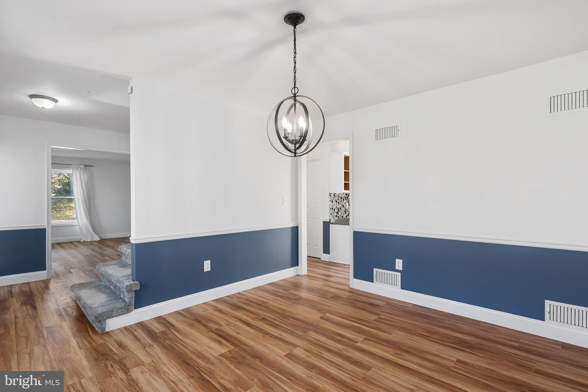 4956 East Berlin Road Thomasville, PA 17364 - Photo 13 of 31 a view of a room with wooden floor and white walls