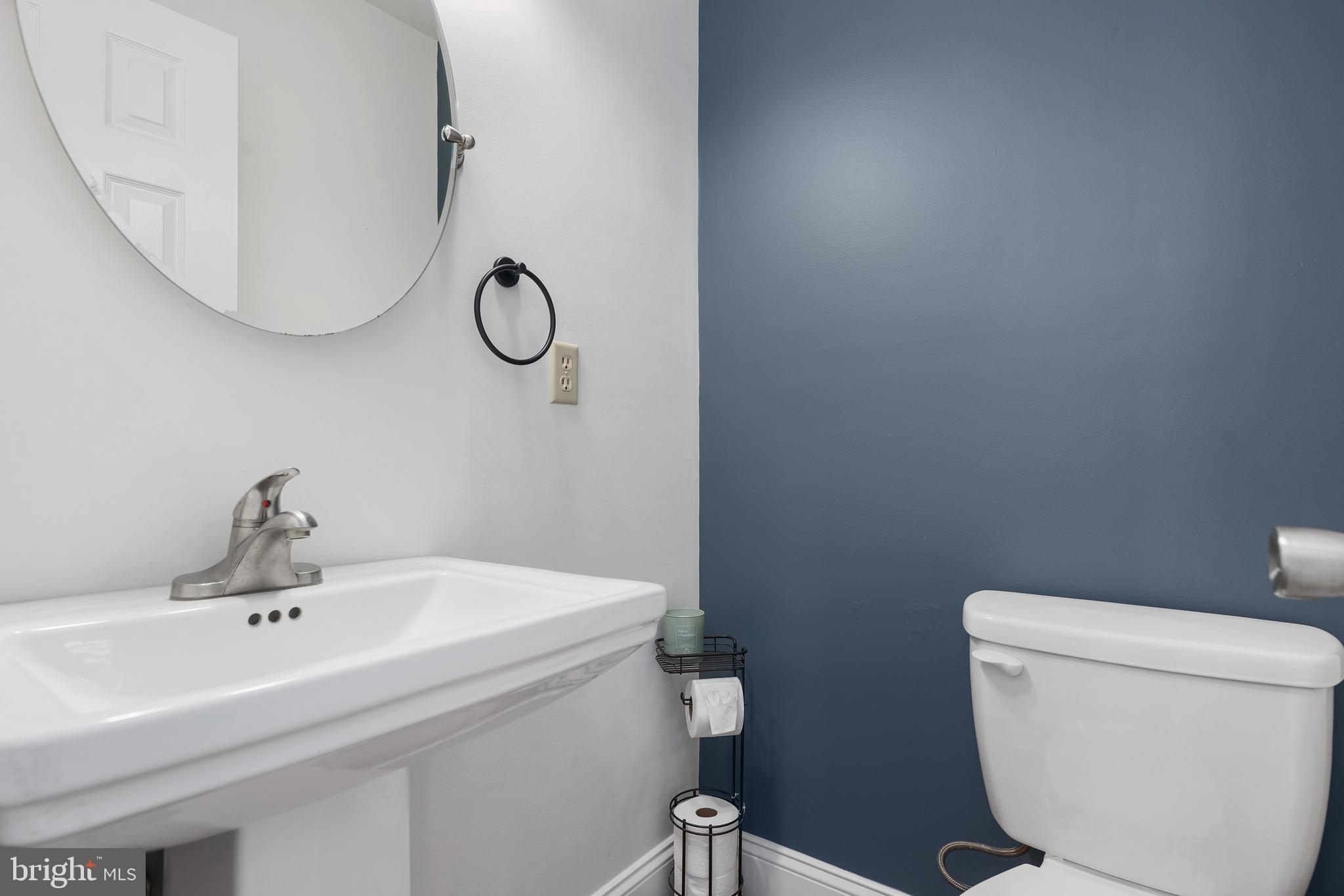 4956 East Berlin Road Thomasville, PA 17364 - Photo 14 of 31 a bathroom with a toilet a sink and mirror