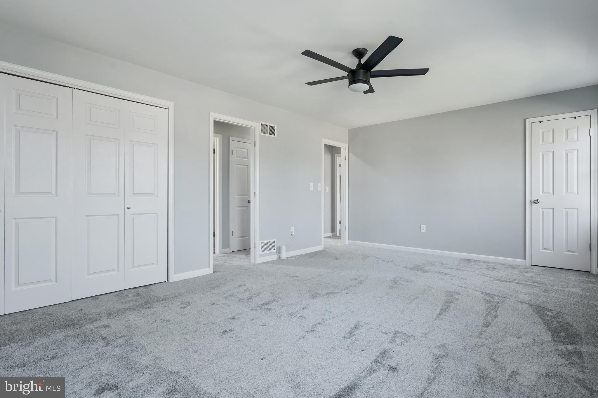 4956 East Berlin Road Thomasville, PA 17364 - Photo 21 of 31 a view of a livingroom with a ceiling fan & windows