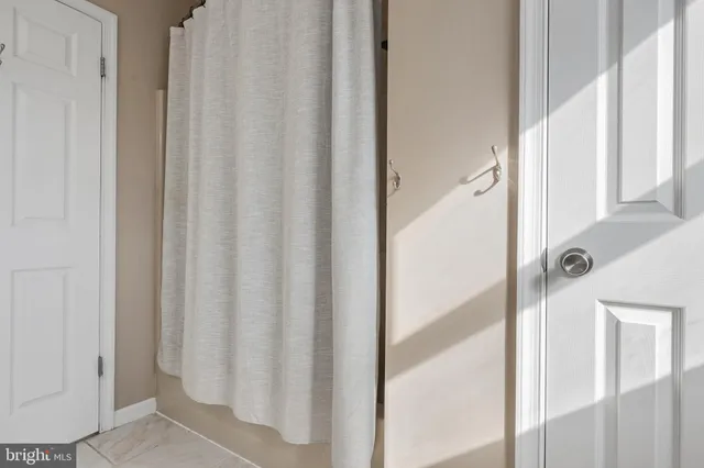 a bathroom with a shower curtain