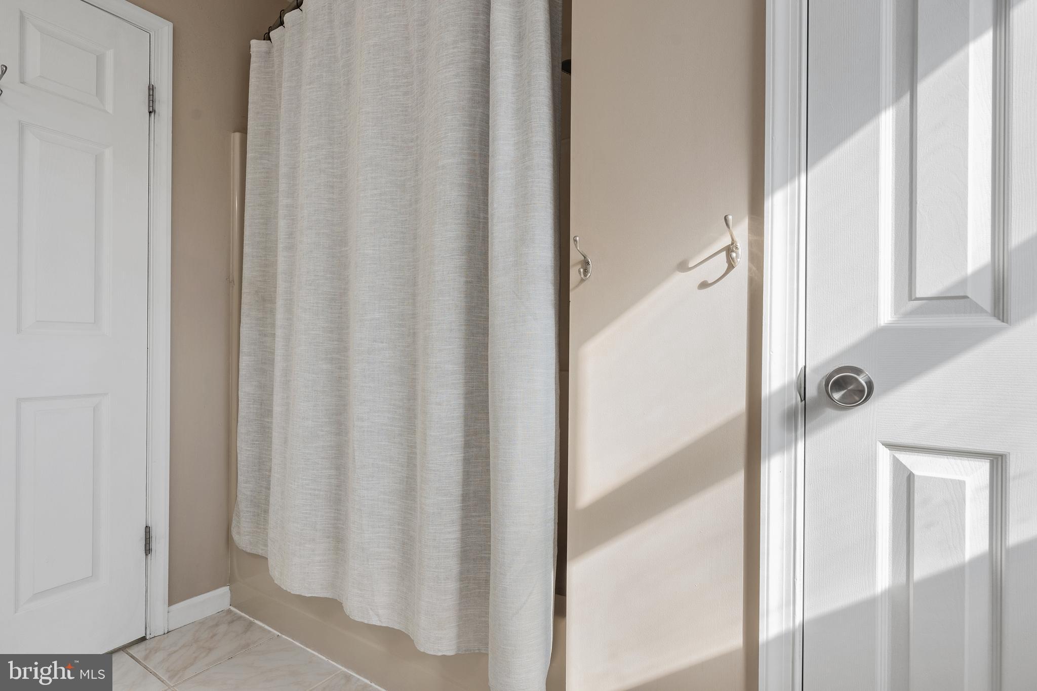 4956 East Berlin Road Thomasville, PA 17364 - Photo 23 of 31 a bathroom with a shower curtain