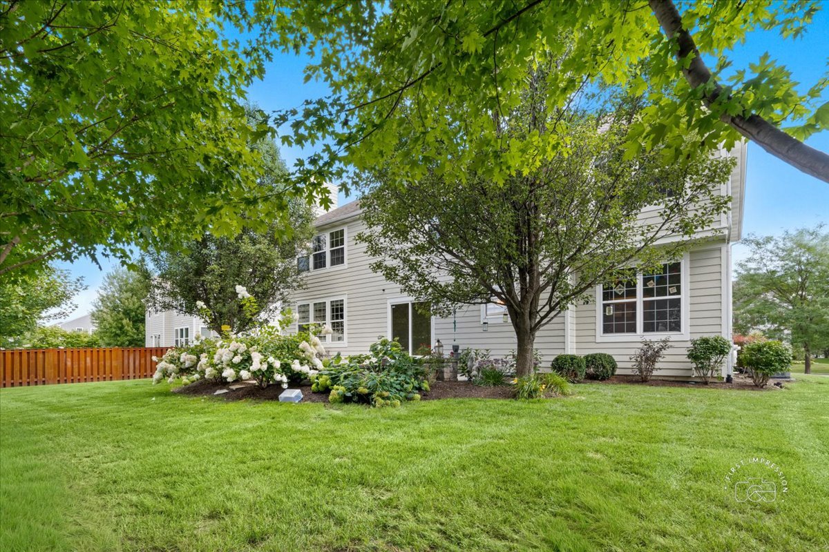 300 Monument Road Elgin, IL 60124 - Photo 32 of 44 a front view of house with a garden