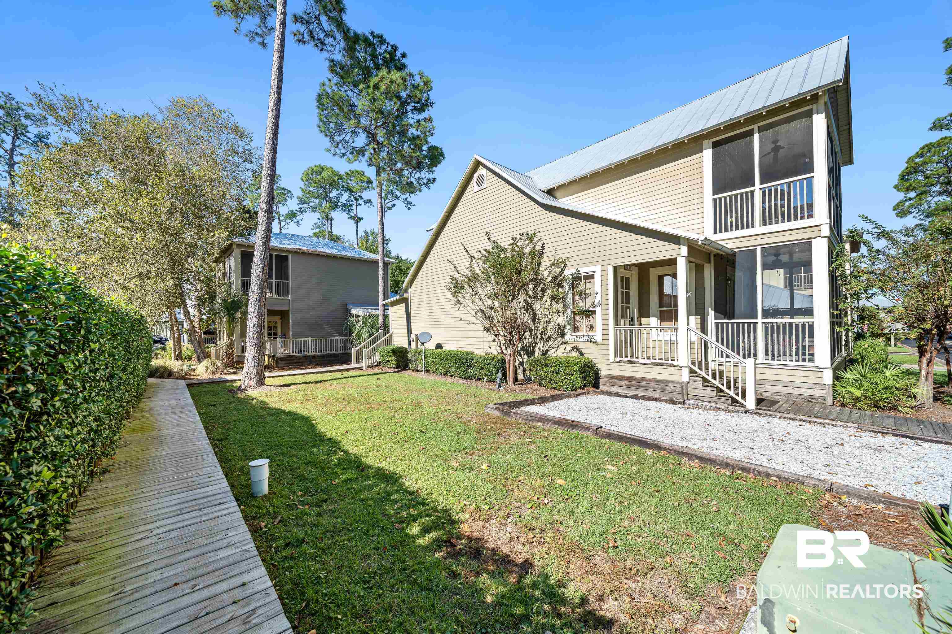 25773 Canal Road, Unit 10 Orange Beach, AL 36561 - Photo 20 of 40 Side of home showing covered porch