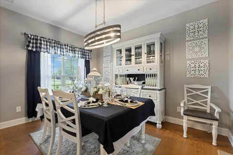 a view of a dining room with furniture window and outside view