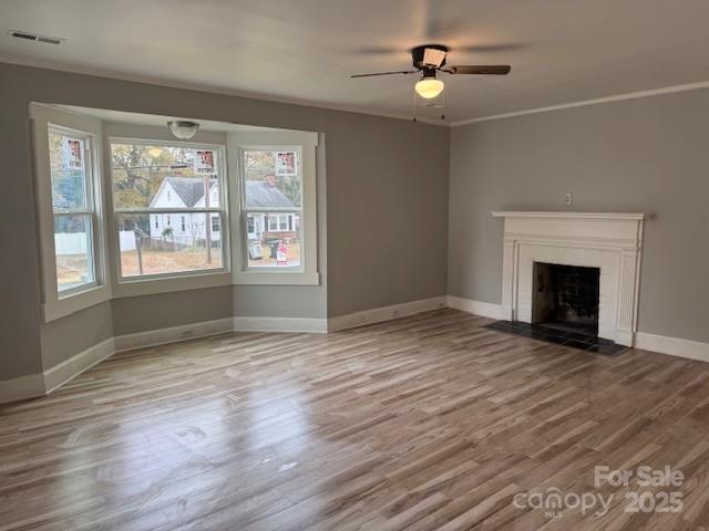 509 North Ransom Street Gastonia, NC 28052 - Photo 5 of 12 a view of empty room with wooden floor and fan