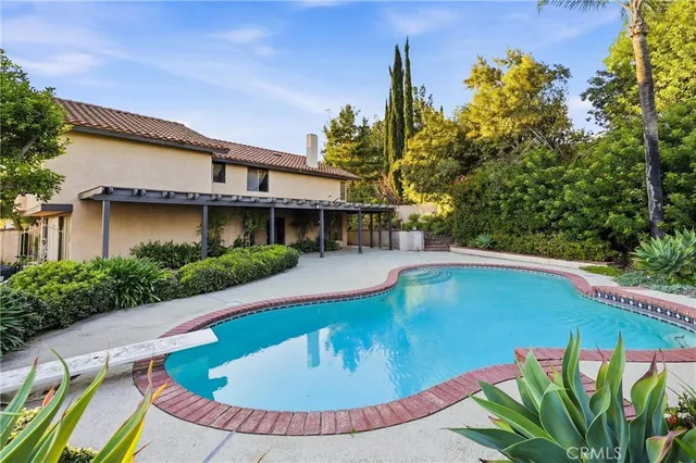 a view of a swimming pool with a patio
