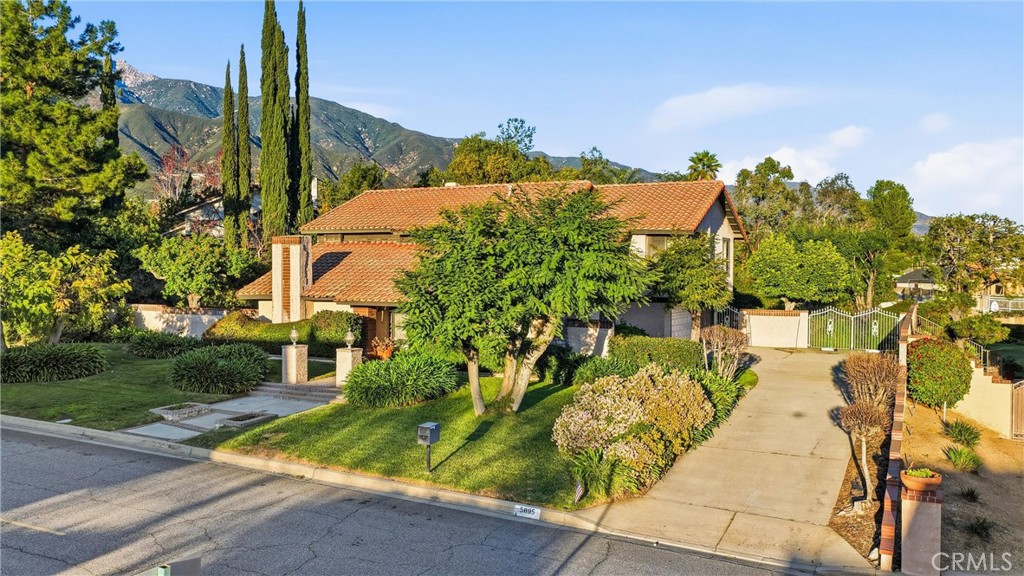 5895 Jadeite Avenue Rancho Cucamonga, CA 91737 - Photo 5 of 8 a view of swimming pool from a garden