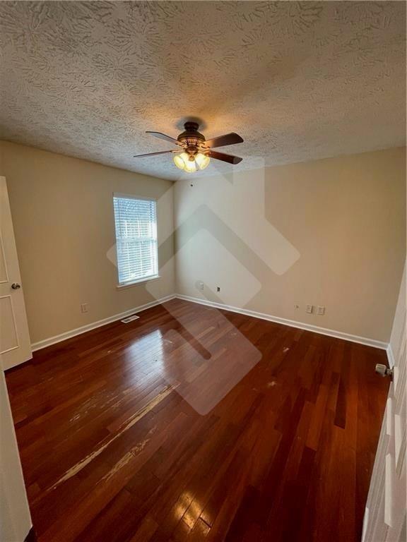 4267 Grogan Street Acworth, GA 30101 - Photo 20 of 37 an empty room with wooden floor and windows