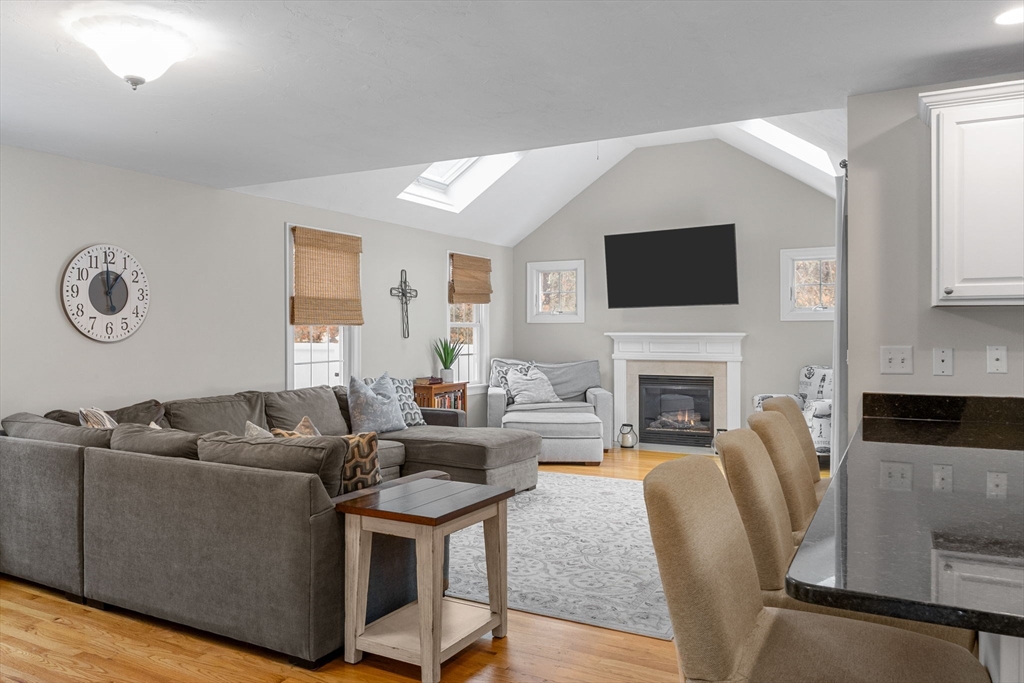 1 Anthony's Way Mashpee, MA 02649 - Photo 15 of 42 a living room with furniture a fireplace and a flat screen tv