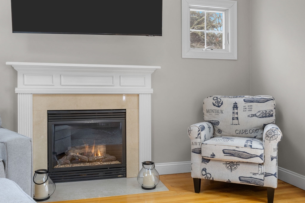 1 Anthony's Way Mashpee, MA 02649 - Photo 18 of 42 a living room with furniture and a fireplace