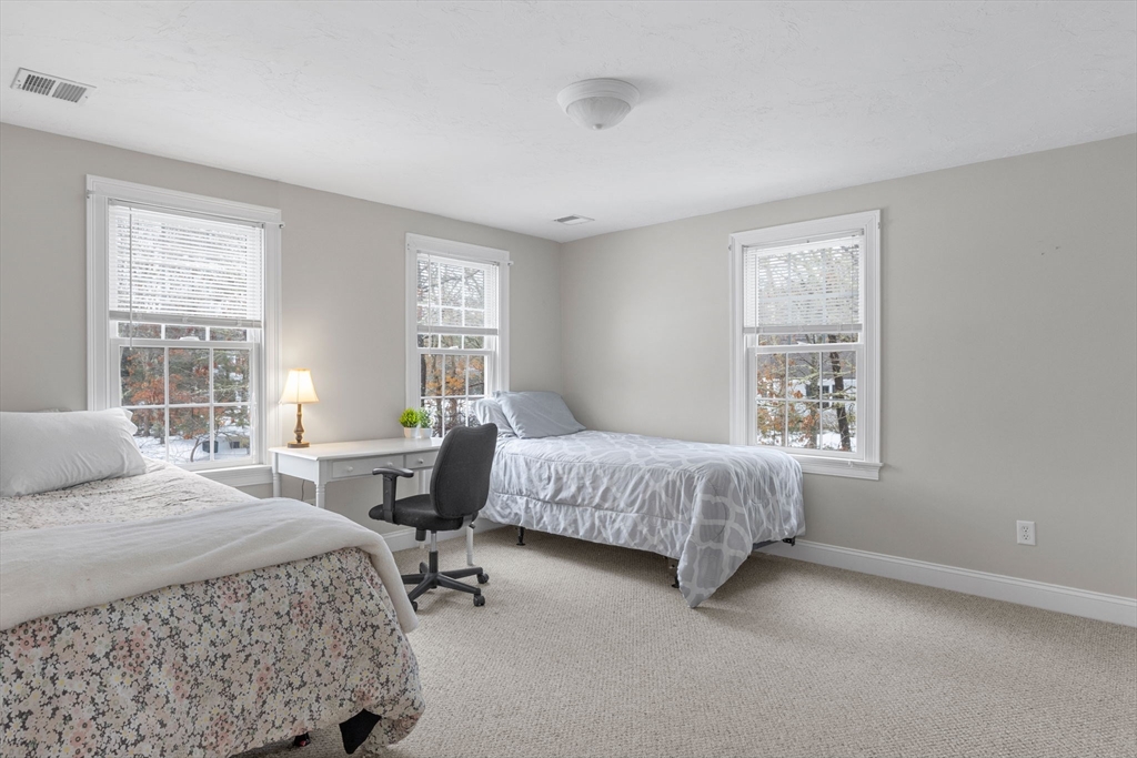 1 Anthony's Way Mashpee, MA 02649 - Photo 22 of 42 a bedroom with a bed chair and two windows