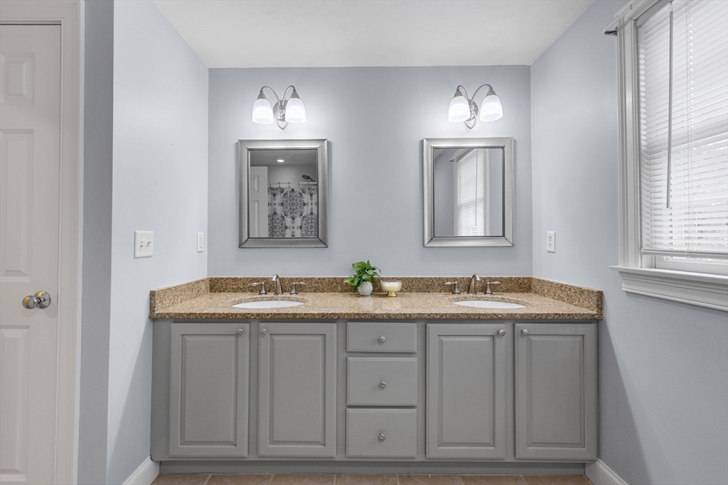 1 Anthony's Way Mashpee, MA 02649 - Photo 26 of 42 a bathroom with a granite countertop sink a toilet a mirror and window