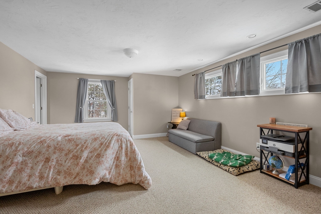 1 Anthony's Way Mashpee, MA 02649 - Photo 27 of 42 a bedroom with a bed and a couch