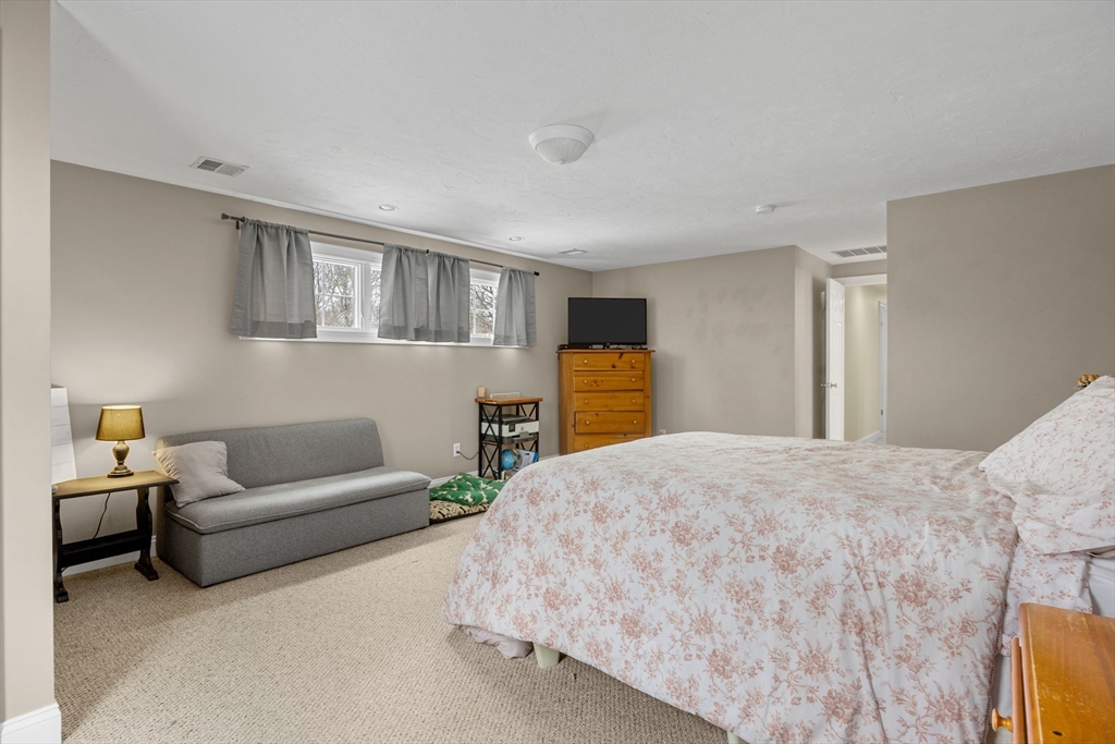 1 Anthony's Way Mashpee, MA 02649 - Photo 29 of 42 a bed room with a bed and a couch