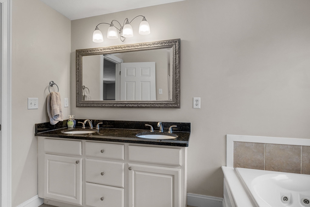 1 Anthony's Way Mashpee, MA 02649 - Photo 31 of 42 a bathroom with a sink and a mirror