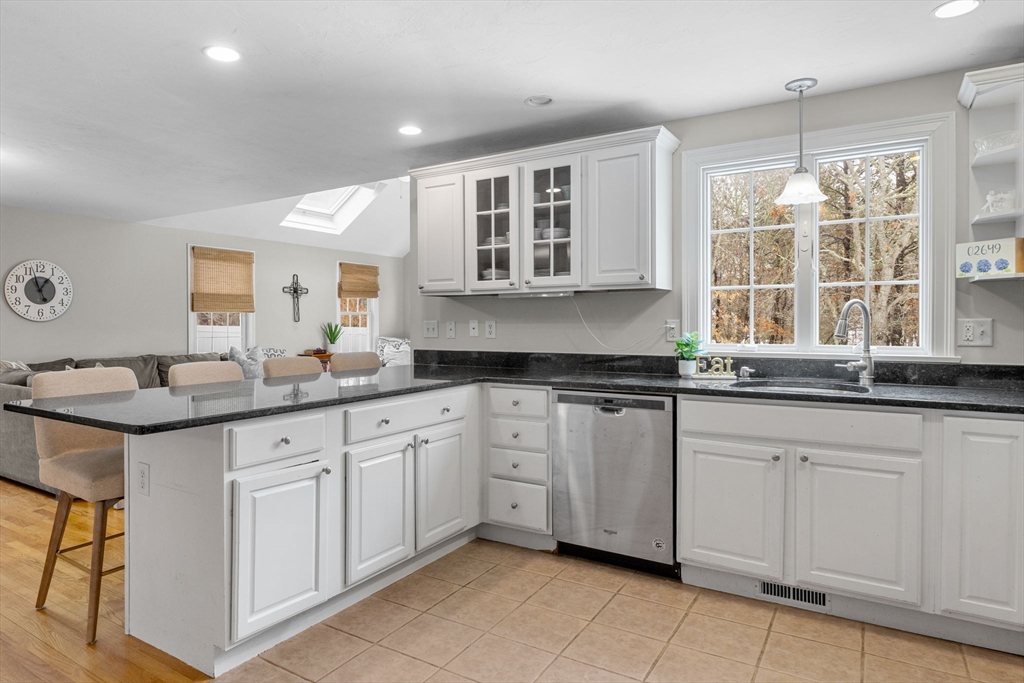 1 Anthony's Way Mashpee, MA 02649 - Photo 7 of 42 a kitchen with granite countertop white cabinets white appliances with a sink and dishwasher
