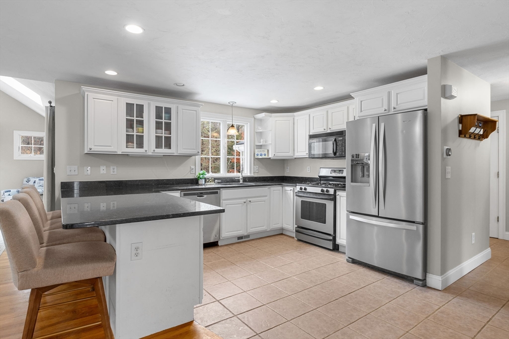 1 Anthony's Way Mashpee, MA 02649 - Photo 10 of 42 a kitchen with stainless steel appliances granite countertop a refrigerator and a stove top oven