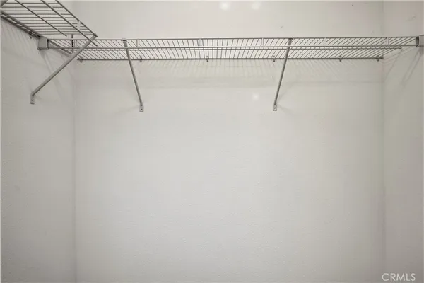 a view of a room with racks on the wall