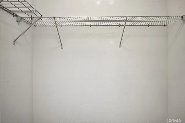 a view of a room with racks on the wall