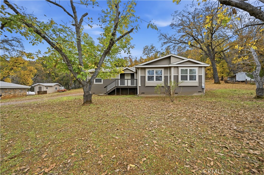 13035 Anderson Road Lower Lake, CA 95457 - Photo 34 of 39 a view of a house with a yard