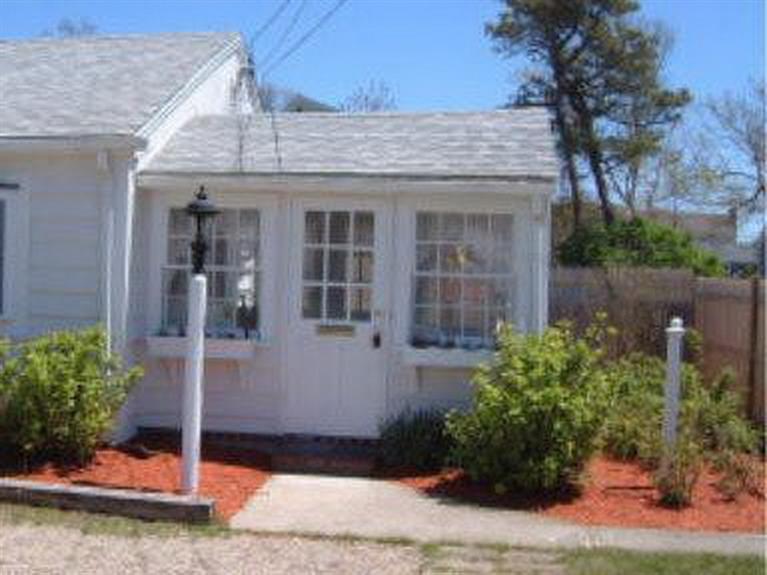188 Captain Chase Road Dennis Port, MA 02639 - Photo 2 of 14 a view of a house with potted plants