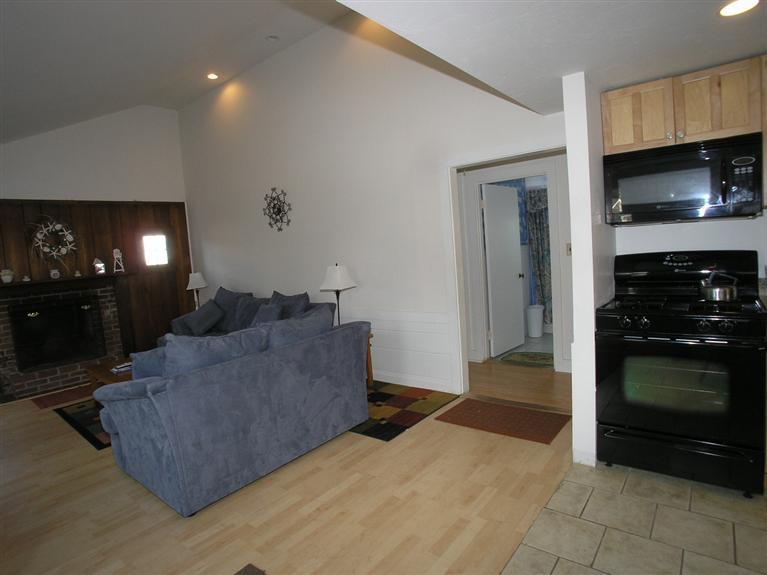 188 Captain Chase Road Dennis Port, MA 02639 - Photo 7 of 14 a living room with furniture and a fireplace